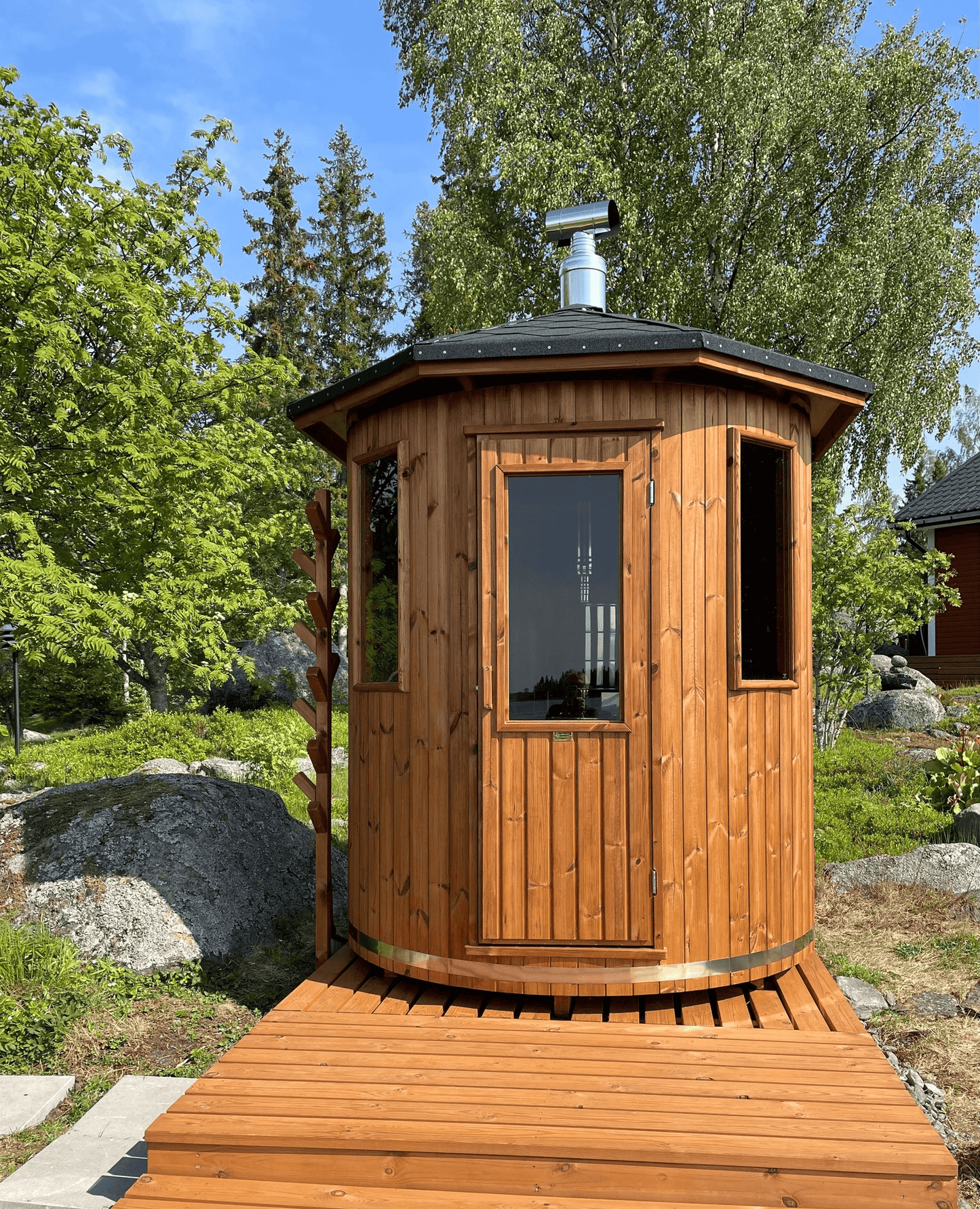 Experience the charm of our wooden cabin sauna, designed with you in mind. This compact yet spacious circular sauna is a versatile gem that can easily find its place in any corner of your garden. It's not just a sauna; it's your personal oasis. Key Featur