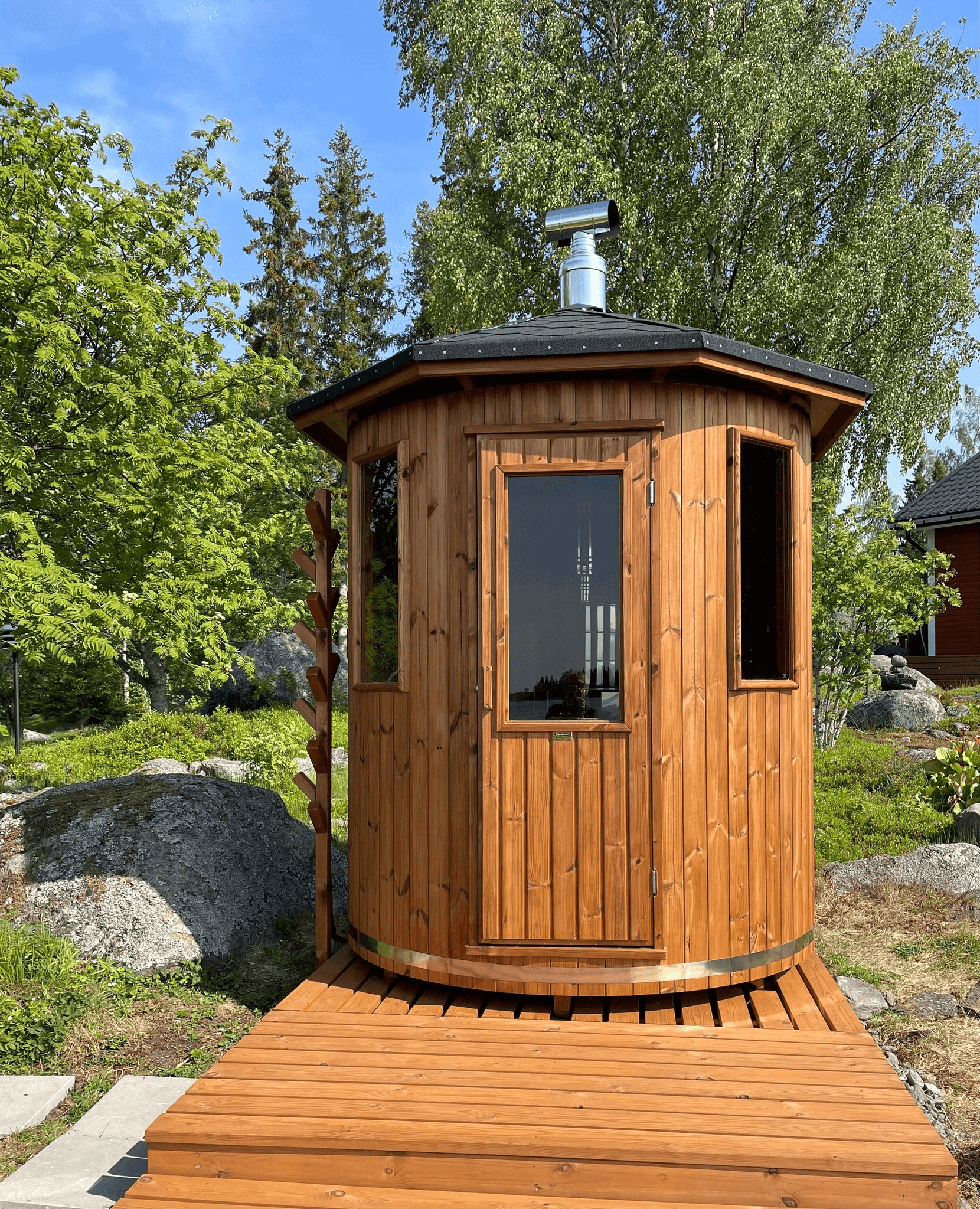Experience the charm of our wooden cabin sauna, designed with you in mind. This compact yet spacious circular sauna is a versatile gem that can easily find its place in any corner of your garden. It's not just a sauna; it's your personal oasis. Key Featur