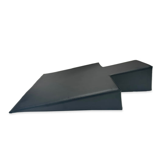 The Elina Pilates Postural Wedge is an accessory designed to provide support and comfort during Pilates practice. It is placed between the shoulder rests of the Reformer, allowing for a slight incline to assist clients with shoulder, neck, or facial injur
