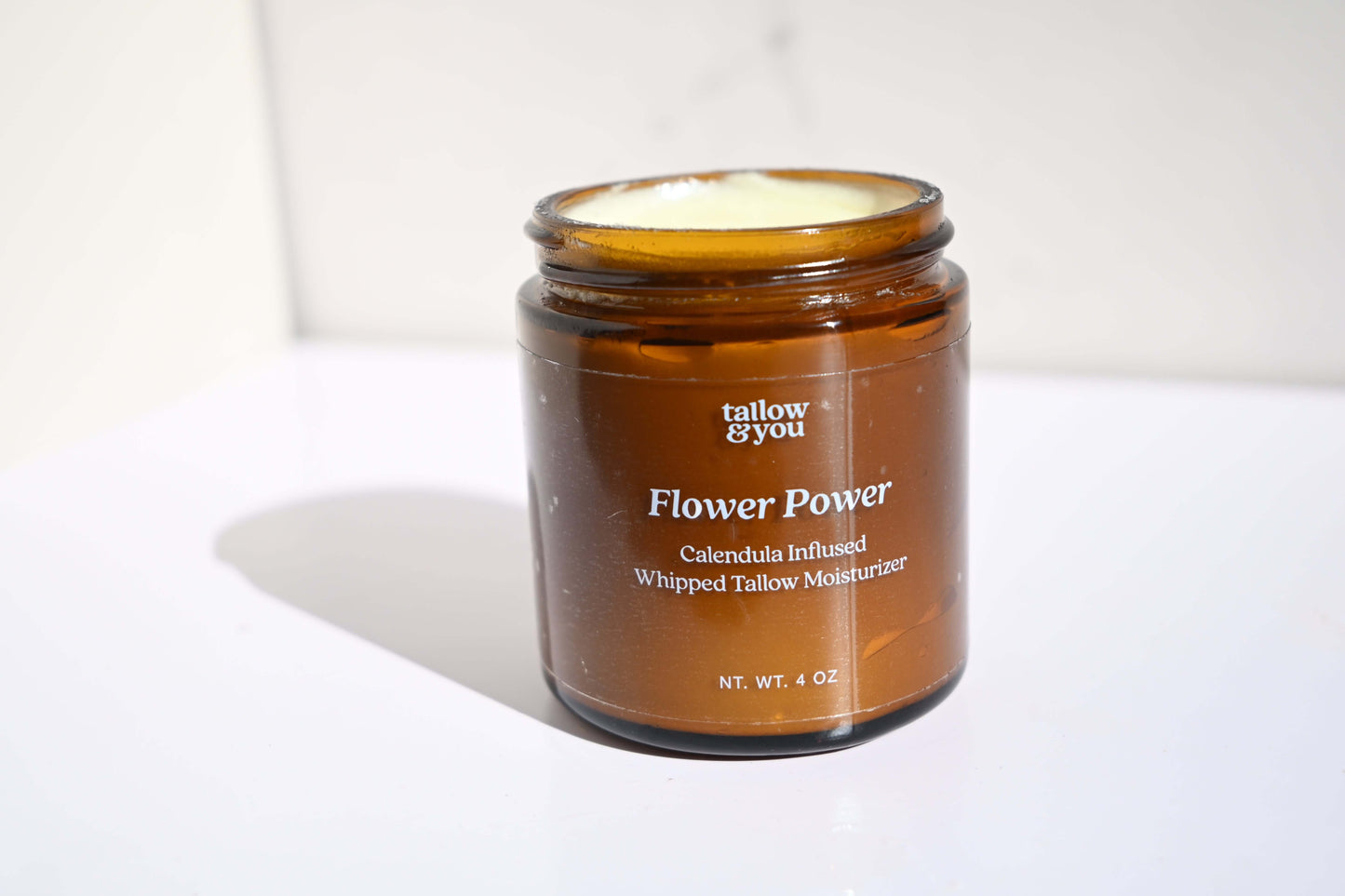 Whipped tallow; Jojoba oil; Infused calendula flower Ingredients: This formula contains 100% grass-fed and finished beef tallow, including vitamins A, E, D, K, B12, omega fatty acids, palmitic, ascorbic and stearic acid and infused calendula flower in joj