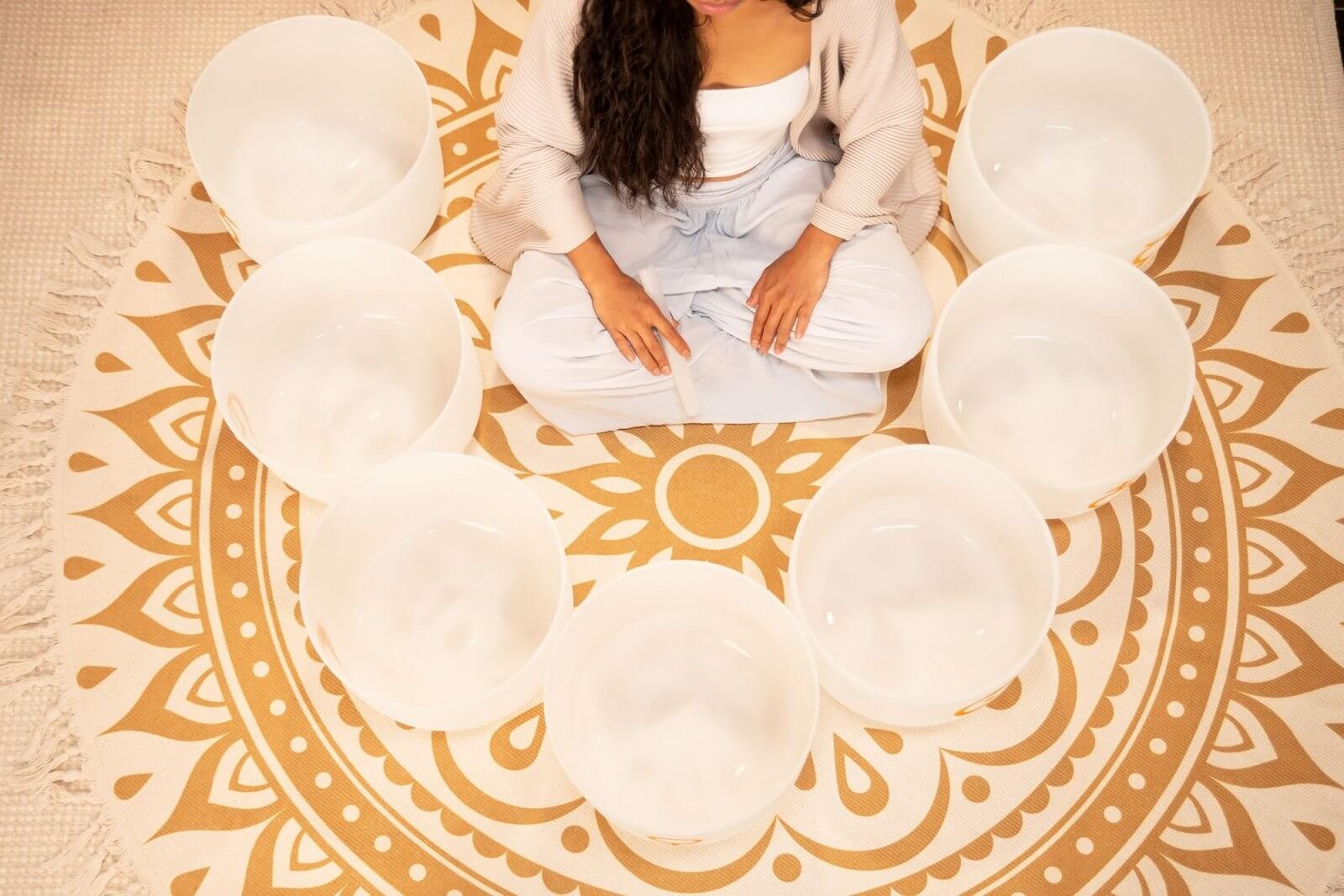 Experience the celestial harmony of the Planetary-Tuned Chakra Set of the Seven Large 12-inch White Frosted Quartz Singing Bowls, meticulously crafted based on Hans Cousto's calculations (author of "The Cosmic Octave") to match the frequencies of the sun,