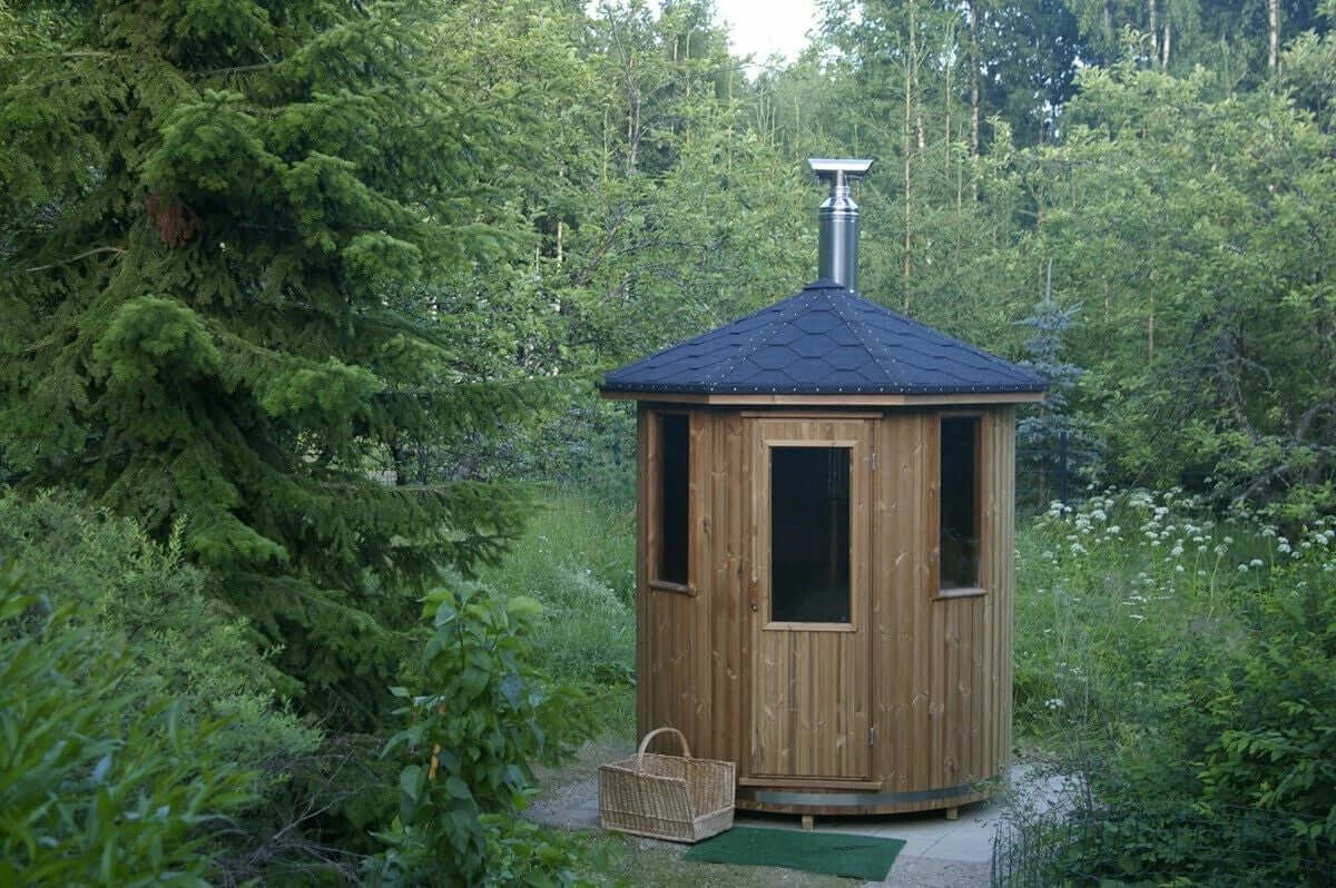 Experience the charm of our wooden cabin sauna, designed with you in mind. This compact yet spacious circular sauna is a versatile gem that can easily find its place in any corner of your garden. It's not just a sauna; it's your personal oasis. Key Featur