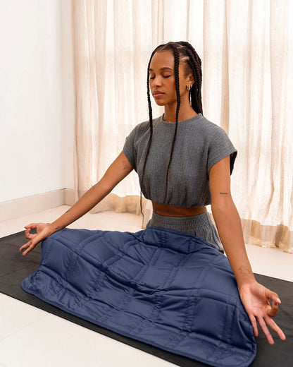 The gentle benefits of a weighted blanket in a compact size! Place it on your lap for better focus while working, on-the-go comfort traveling, or across your body after yoga for a next level savasana. Optional cover has a simple sham closure and connectiv