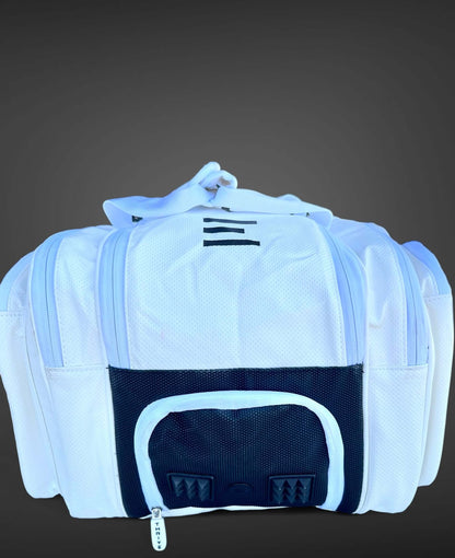 Thrive new Elite Pro Tour Bag in white is made of 100% vegan leather and designed for the player who wants to look good and travel to the courts in style. This bag has room for all your paddles and accessories and doubles as carry-on luggage. The backpack