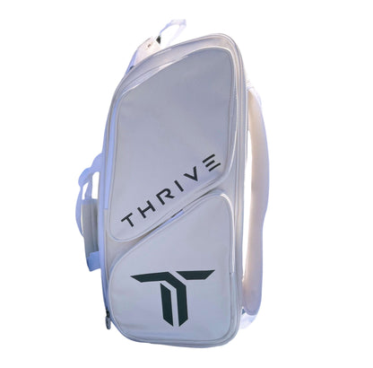Thrive new Elite Pro Tour Bag in white is made of 100% vegan leather and designed for the player who wants to look good and travel to the courts in style. This bag has room for all your paddles and accessories and doubles as carry-on luggage. The backpack