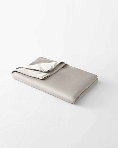 The gentle benefits of a weighted blanket in a compact size! Place it on your lap for better focus while working, on-the-go comfort traveling, or across your body after yoga for a next level savasana. Optional cover has a simple sham closure and connectiv