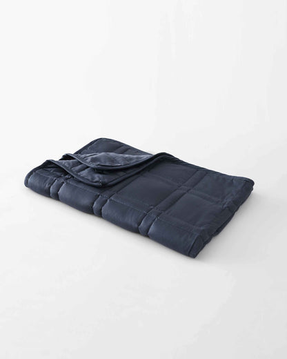 The gentle benefits of a weighted blanket in a compact size! Place it on your lap for better focus while working, on-the-go comfort traveling, or across your body after yoga for a next level savasana. Optional cover has a simple sham closure and connectiv