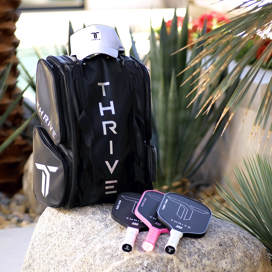 Thrive Elite Pro Tour Bag is made of 100% vegan leather and designed for the player who wants to look good and travel to the courts in style. This bag has room for all your paddles and accessories and doubles as carry-on luggage. The backpack straps have
