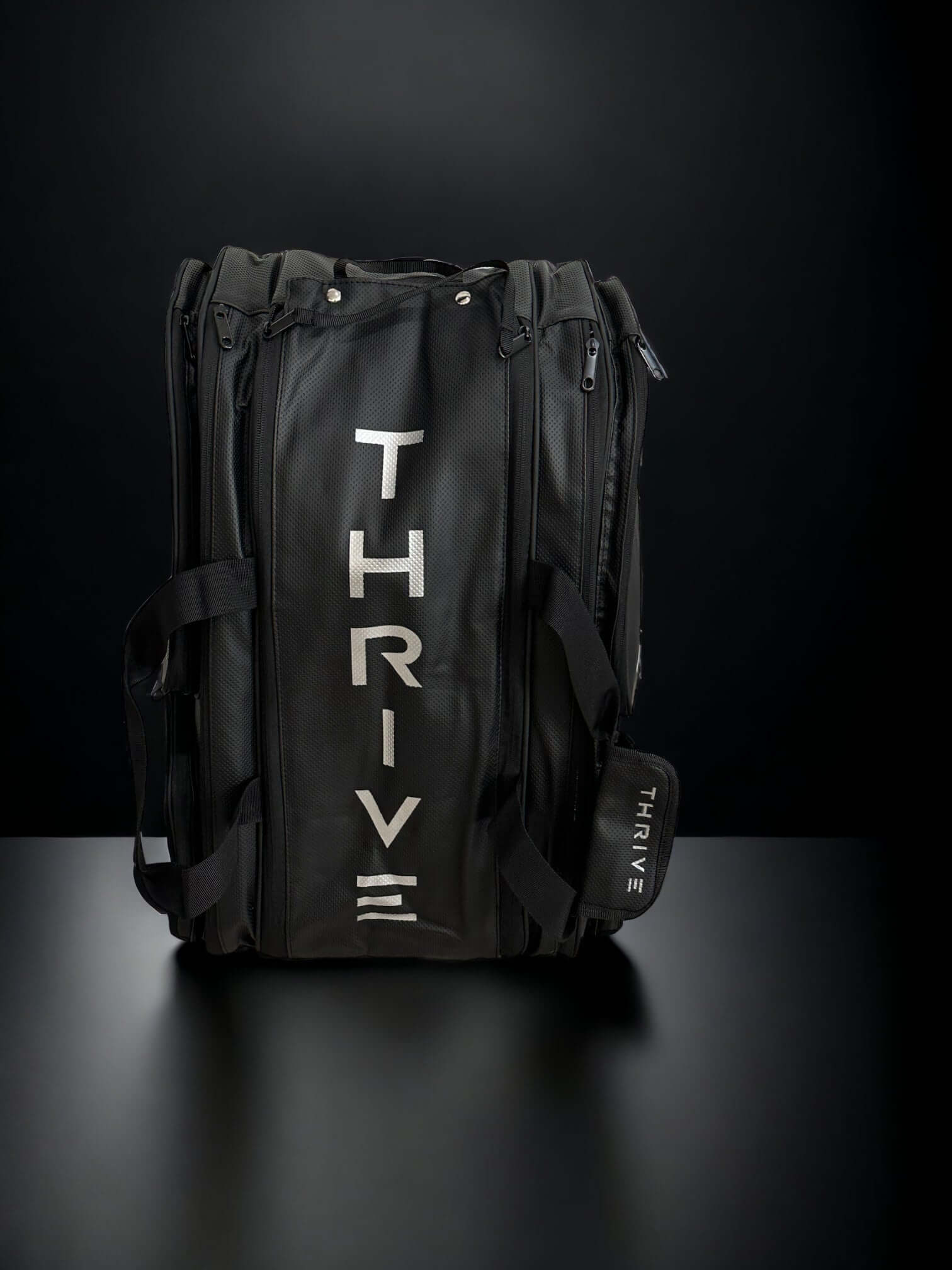Thrive Elite Pro Tour Bag is made of 100% vegan leather and designed for the player who wants to look good and travel to the courts in style. This bag has room for all your paddles and accessories and doubles as carry-on luggage. The backpack straps have