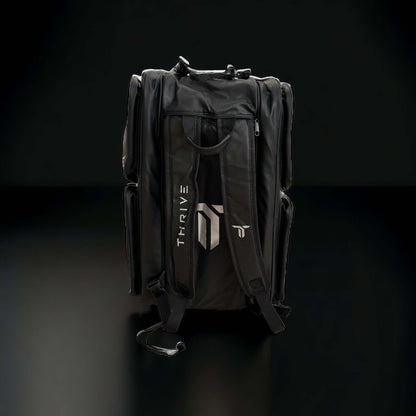 Thrive Elite Pro Tour Bag is made of 100% vegan leather and designed for the player who wants to look good and travel to the courts in style. This bag has room for all your paddles and accessories and doubles as carry-on luggage. The backpack straps have