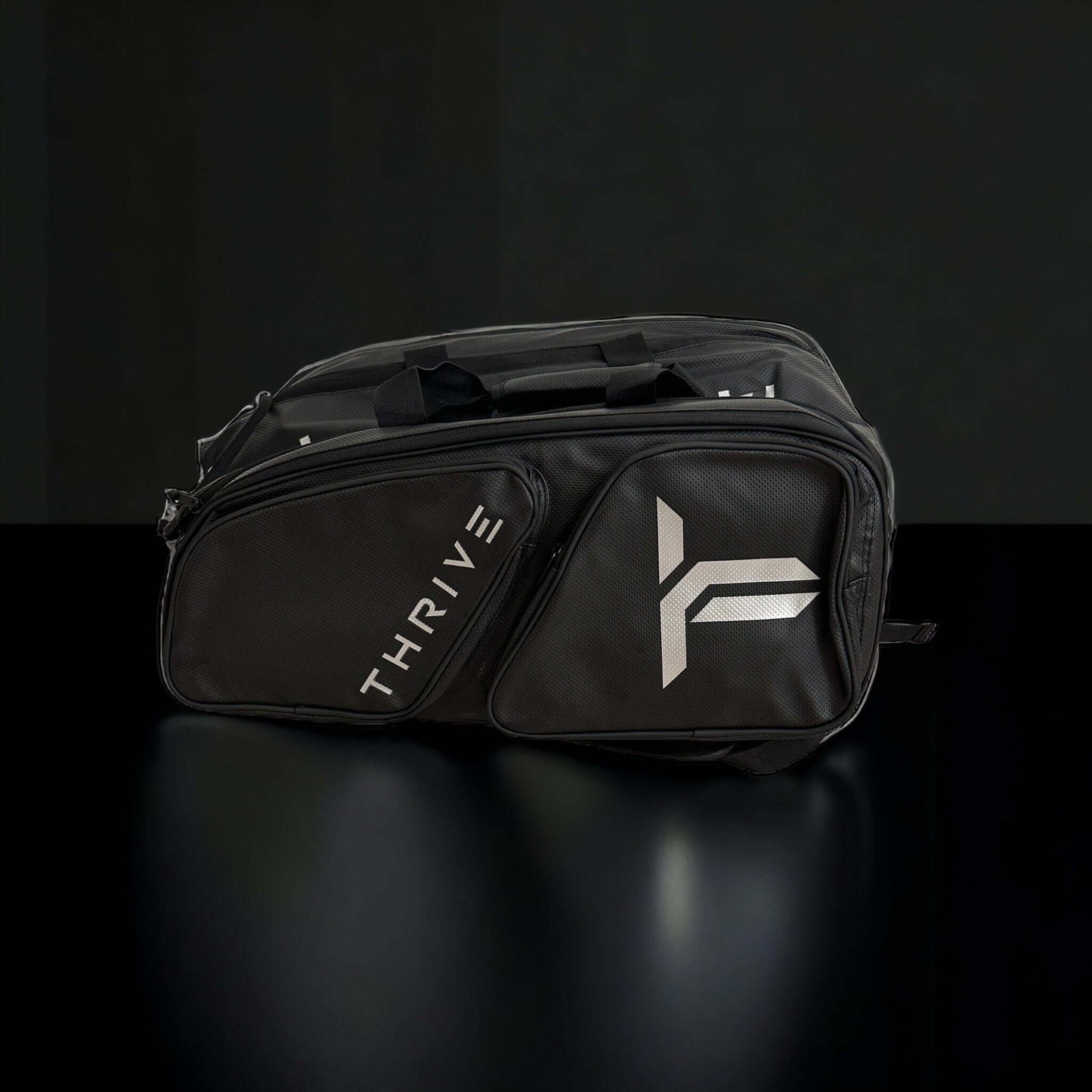 Thrive Elite Pro Tour Bag is made of 100% vegan leather and designed for the player who wants to look good and travel to the courts in style. This bag has room for all your paddles and accessories and doubles as carry-on luggage. The backpack straps have