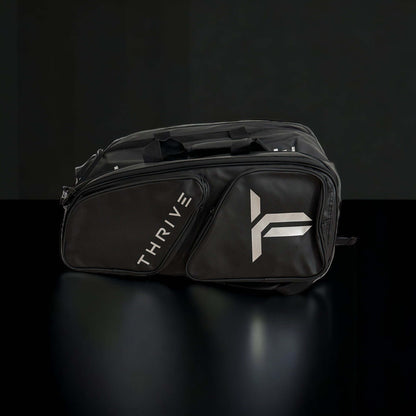 Thrive Elite Pro Tour Bag is made of 100% vegan leather and designed for the player who wants to look good and travel to the courts in style. This bag has room for all your paddles and accessories and doubles as carry-on luggage. The backpack straps have