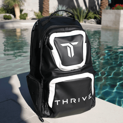 Thrive Elite Backpack is made of 100% vegan leather and designed for the player who prefers using a smaller backpack then our Tour Bag. This backpack still maintains a stylish and sleek look while having all the functionality of would expect. This backpac