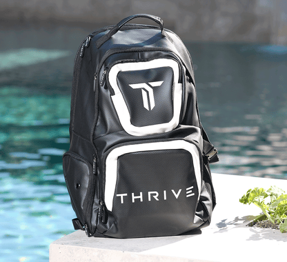 Thrive Elite Backpack is made of 100% vegan leather and designed for the player who prefers using a smaller backpack then our Tour Bag. This backpack still maintains a stylish and sleek look while having all the functionality of would expect. This backpac